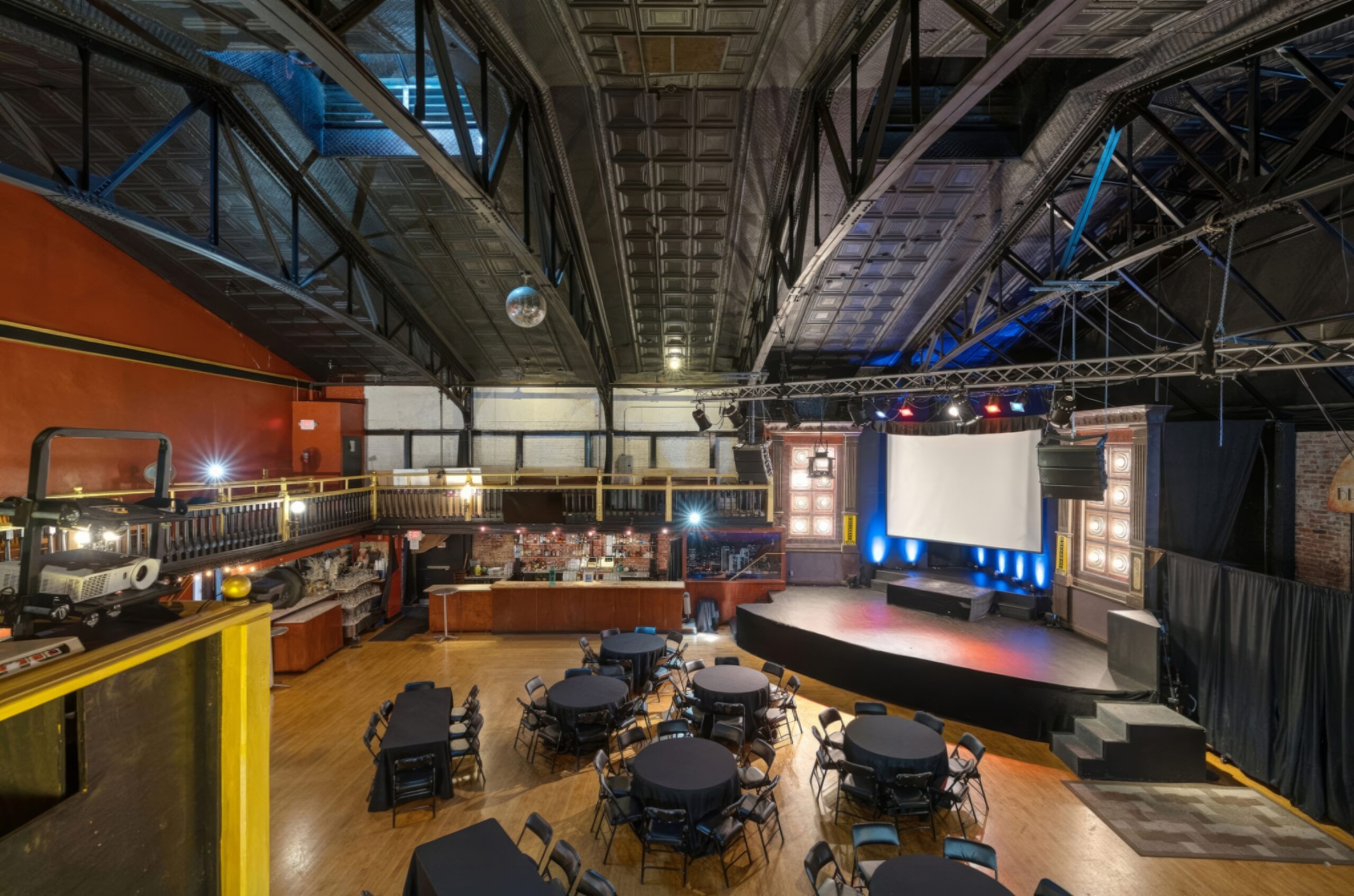Broadway Studios theatre and balcony with round tables on the floor