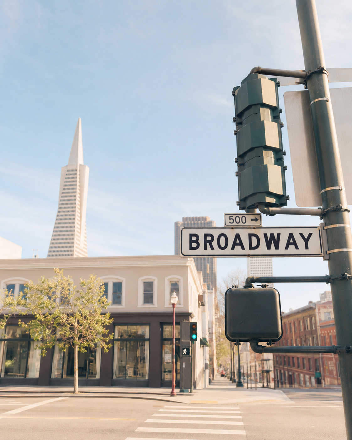 The Broadway street sign and the Transamerica Pyramid in San Francisco