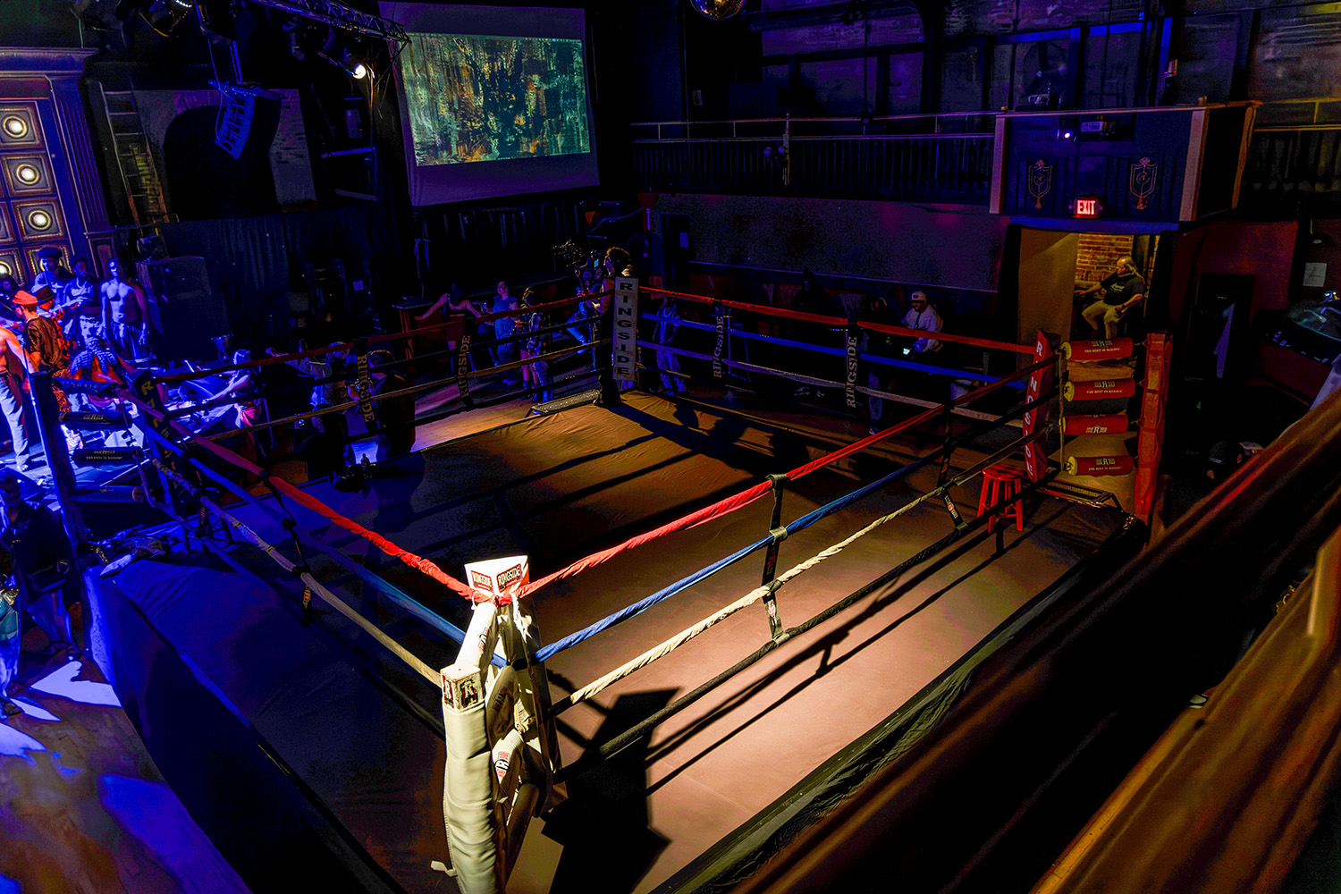 A boxing ring at the center of Broadway Studios, viewed from the balcony during a private exhibition